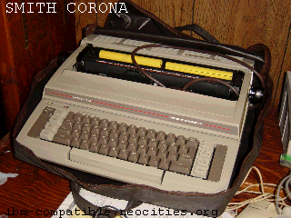 a beige electric typewriter inside its case. Though heavy, it can be carried easily.